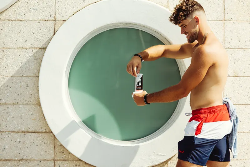 Opening a GameDay Spiked can poolside